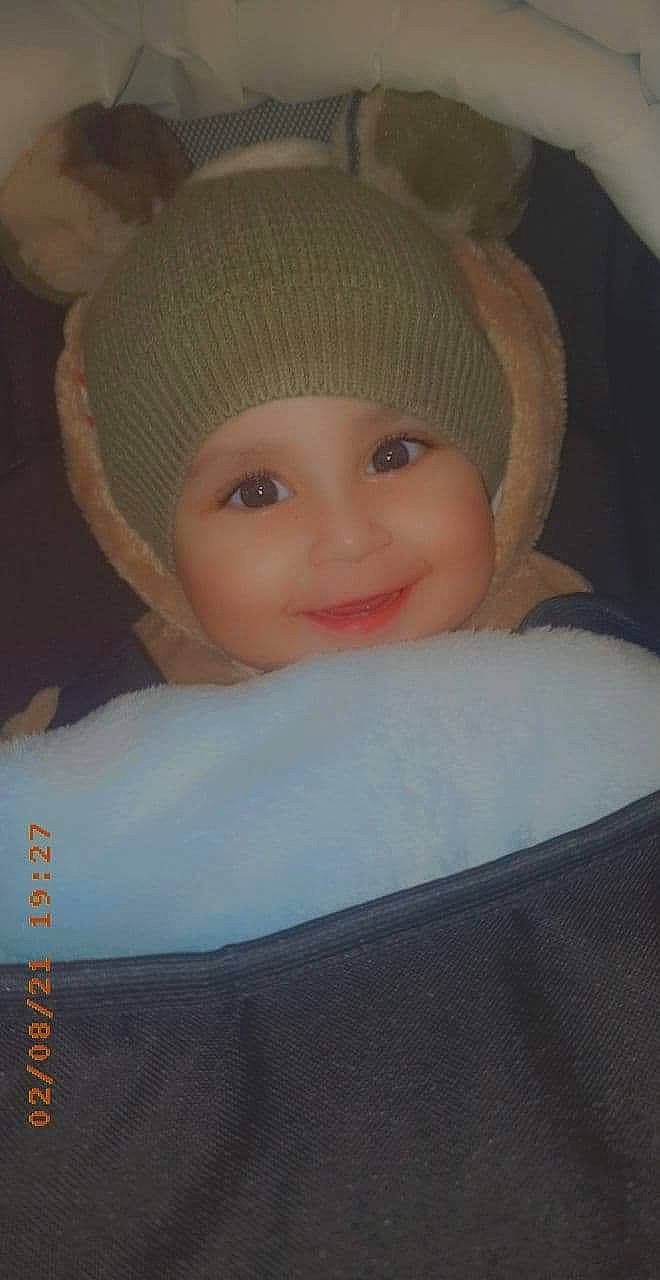 Fernando is registered to the contest to win money with this photo: baby, cap, cheek, eye, fashion_accessory, hair, happy, hat, head, headgear, headwear, human_body, iris, joy, knit_cap, lip, nose, person, skin, smile