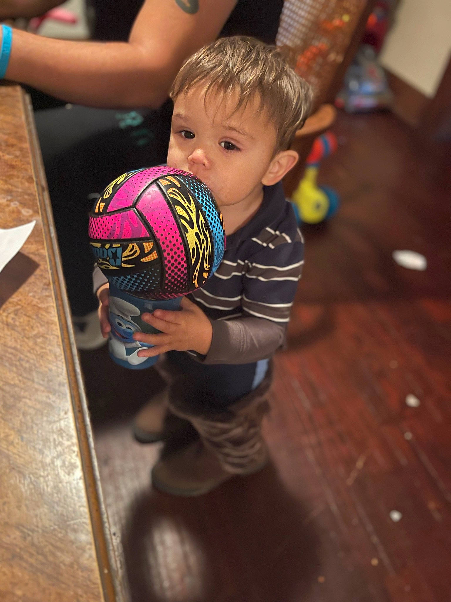 Jesus is registered to the contest to win money with this photo: arm, baby, ball, child, flooring, football, fun, happy, hardwood, leisure, person, play, recreation, room, soccer_ball, sports_equipment, sports_toy, t_shirt, toddler, toy