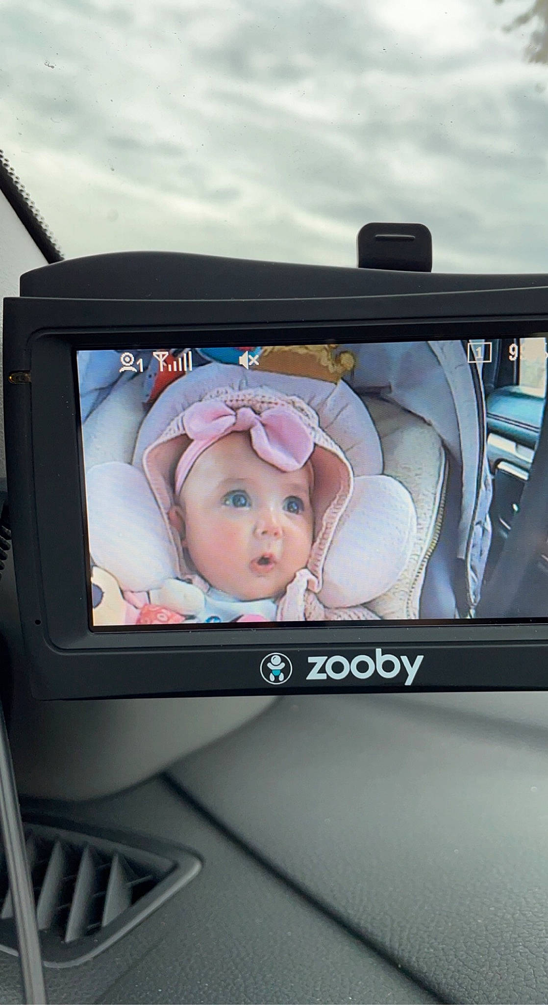 Charli is registered to the contest to win money with this photo: audio_equipment, auto_part, baby, baby_products, baby_safety, car_seat, cloud, comfort, communication_device, digital_camera, display_device, family_car, font, gadget, headwear, luxury_vehicle, motor_vehicle, multimedia, output_device, person