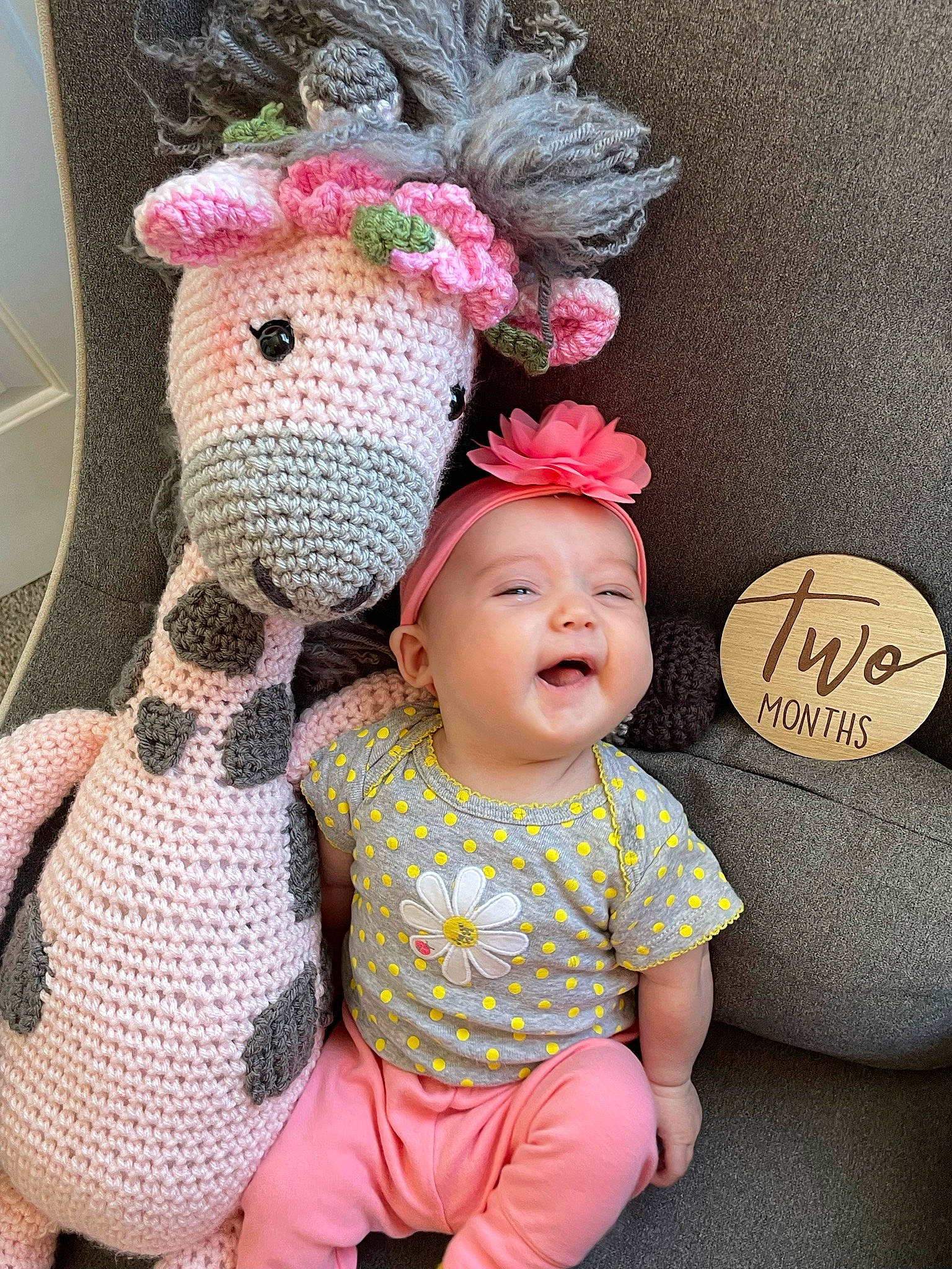 Charli is registered to the contest to win money with this photo: baby, baby_products, baby_toddler_clothing, cap, child, comfort, happy, head, headgear, headwear, linens, magenta, pattern, person, pink, plush, shelf, stuffed_toy, textile, toddler
