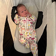Sienna joined the competition — help win amazing prizes! baby, newborn, infant, onesie, unicorn_pattern, rainbow_pattern, baby_seat, cushion, soft_fabric, sleepwear, cute, small, child, indoor, portrait, baby_clothing, resting, lying_down, pink, white