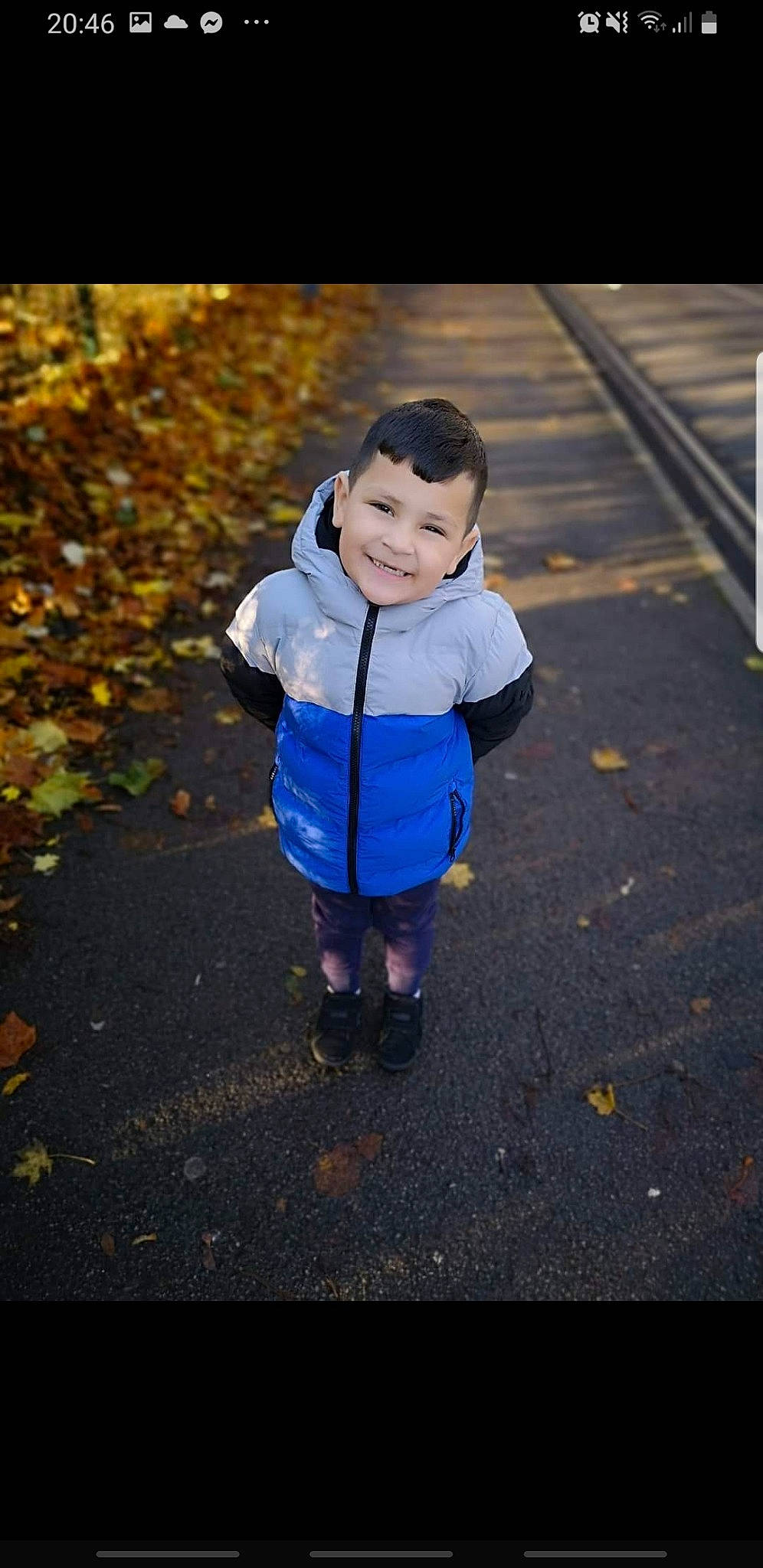 Samuel is registered to the contest to win money with this photo: asphalt, baby_toddler_clothing, child, electric_blue, fun, grass, happy, joy, leaf, people_in_nature, person, plant, recreation, road, road_surface, sidewalk, smile, standing, sunlight, tar