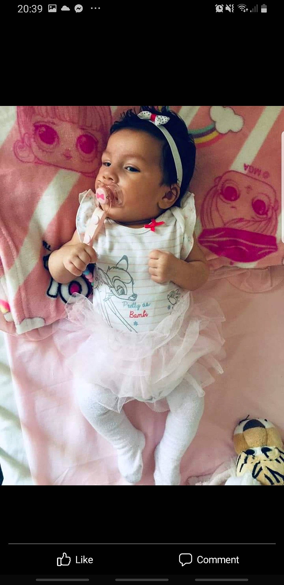 Selina is registered to the contest to win money with this photo: arm, baby, baby_toddler_clothing, beauty, child, dress, event, face, finger, gesture, happy, head, magenta, person, photograph, pink, skin, sleeve, t_shirt, textile