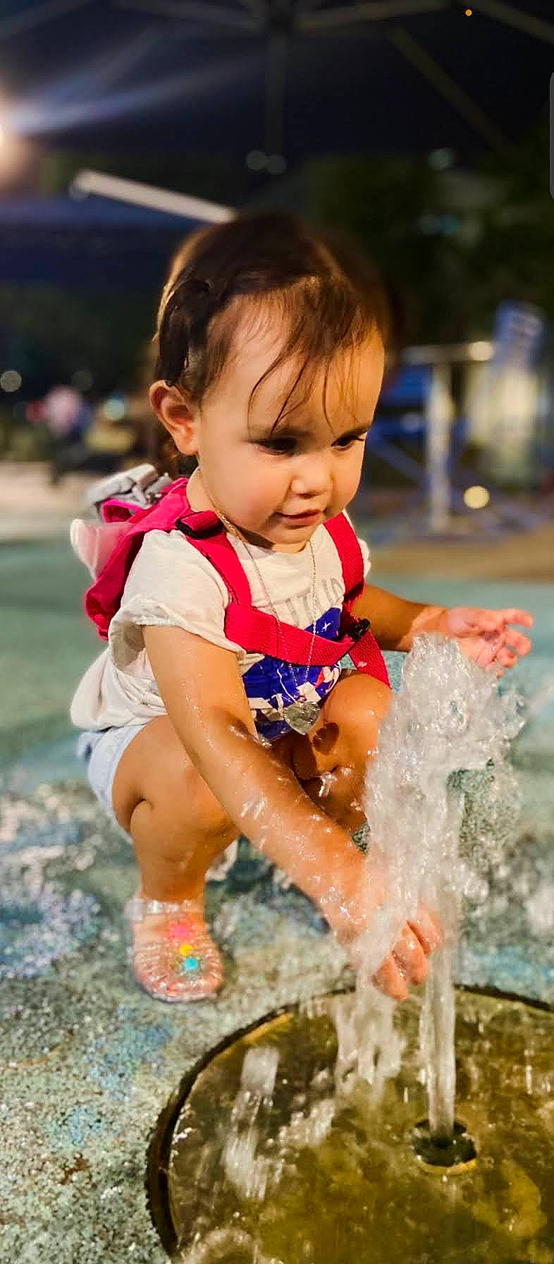 Aribella is registered to the contest to win money with this photo: baby, baby_toddler_clothing, bathing, beauty, child, fun, grass, happy, leisure, people_in_nature, person, personal_protective_equipment, play, public_space, recreation, sand, sitting, soil, spring, toddler