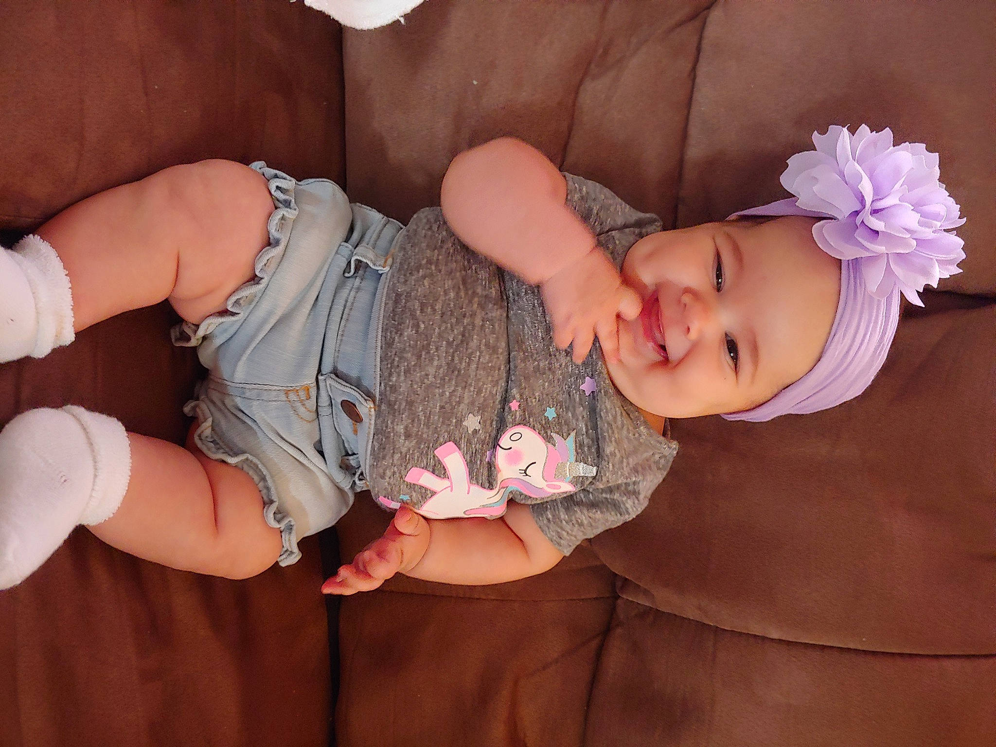 Emmalina is registered to the contest to win money with this photo: arm, baby, baby_toddler_clothing, child, finger, hair_accessory, hand, headwear, joy, person, pink, toddler