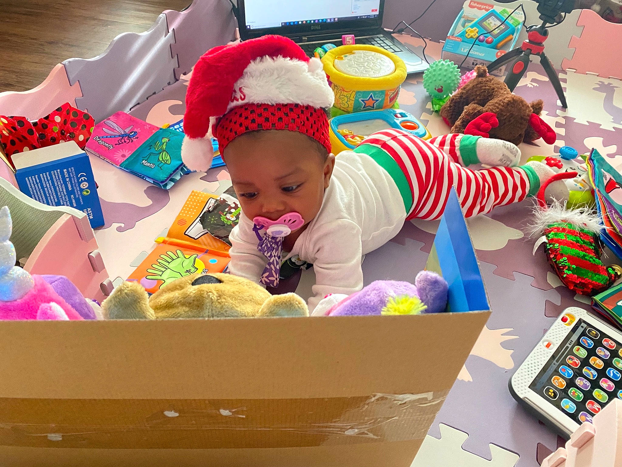 Khalani is registered to the contest to win money with this photo: baby, baby_toys, box, carton, child, event, fun, happy, holiday, leisure, packaging_and_labeling, packing_materials, party_supply, person, play, room, sharing, shipping_box, stuffed_toy, toddler