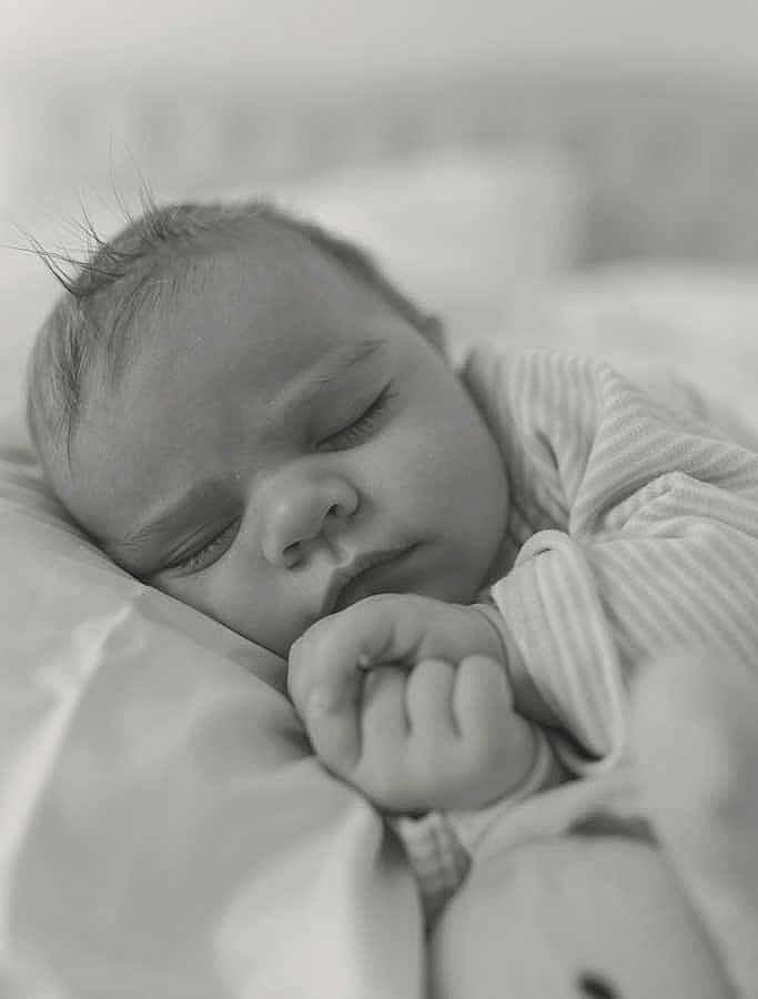 Colton joined the competition — help win amazing prizes! baby, sleeping, close_up, black_and_white, infant, hand, soft, peaceful, face, child, bed, blanket, portrait, newborn, cute, relaxation, cozy, toddler, calm, expression