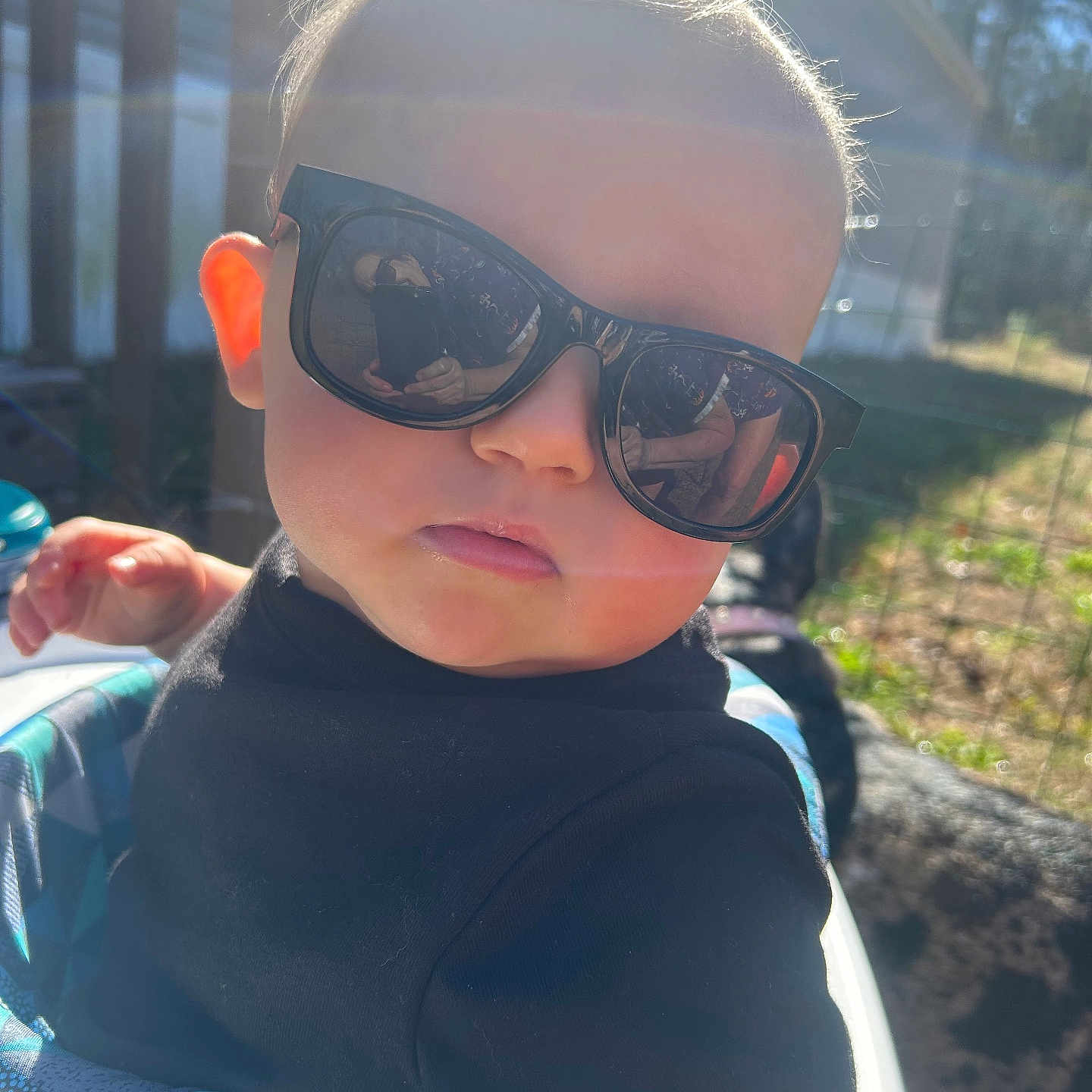 Karson joined the competition — help win amazing prizes! baby, baby_seat, backyard, black_shirt, child, chubby_cheeks, cool_expression, cute, dog, hair, hand, outdoor, person, portrait, reflection, sunflare, sunglasses, sunglasses_reflection, sunlight, toddler
