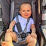 Karson joined the competition — help win amazing prizes! baby, infant, stroller, harness, smiling, blue_eyes, chubby_legs, onesie, seat, buckle, outdoors, sunlight, happy, portrait, child, baby_feet, baby_hand, padded_seat, fabric, cute