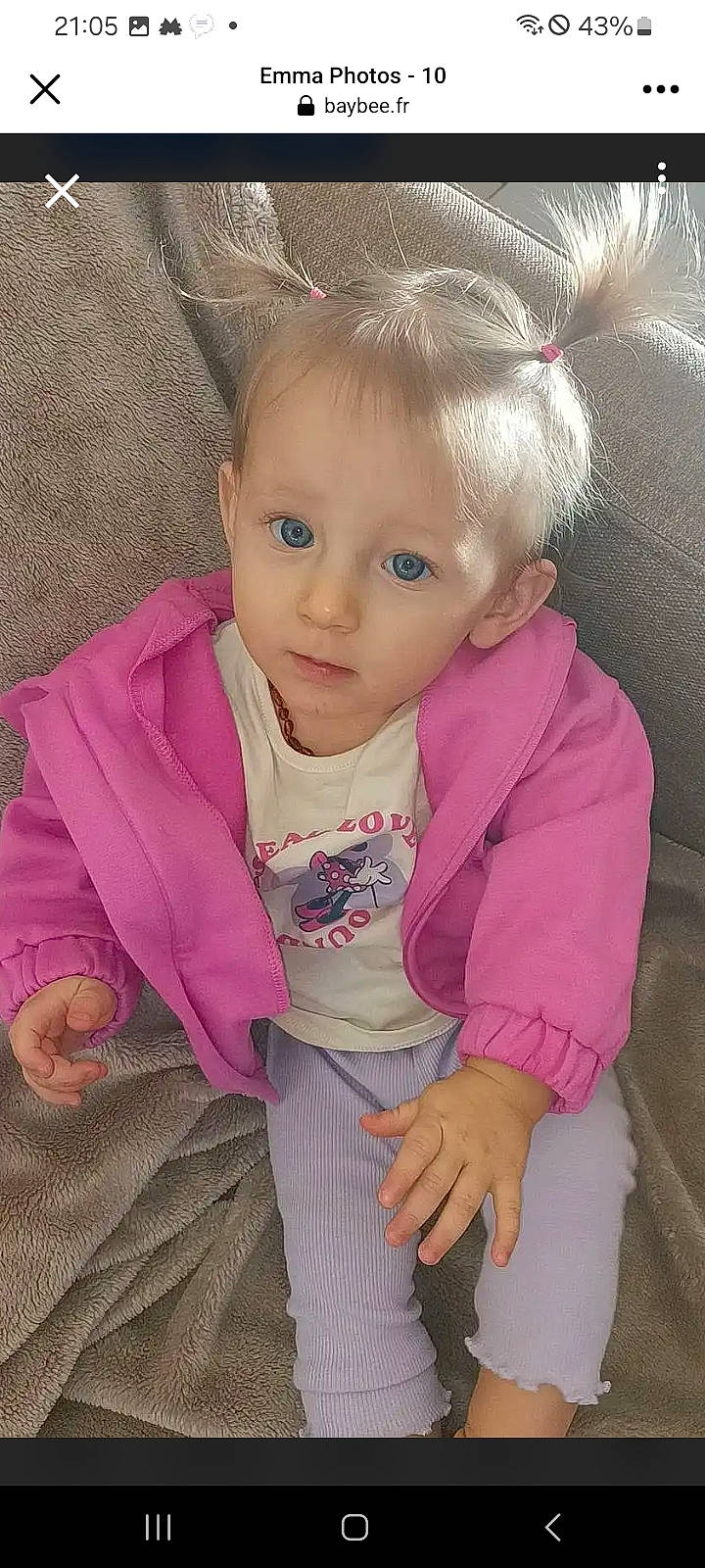 Emma participe au concours pour gagner de l'argent avec cette photo : baby, baby_toddler_clothing, cheek, eye, eyebrow, eyelash, face, flooring, hair, happy, head, human_body, lip, nose, outerwear, person, pink, skin, sleeve, smile