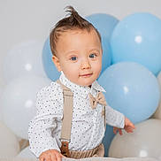 Justin joined the competition — help win amazing prizes! toddler, child, baby, blue_eyes, mohawk, polka_dot, shirt, suspenders, bow_tie, balloons, blue, white, couch, hand, curious, portrait, indoor, cute, fashion, smile