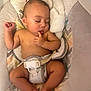 Jermaine joined the competition — help win amazing prizes! baby, sleeping, infant, cushion, plush_toy, baby_seat, comfort, peaceful, child, skin, fingers, rest, indoors, soft_texture, pastel_colors, closeup, adorable, relaxation, toddler, cute
