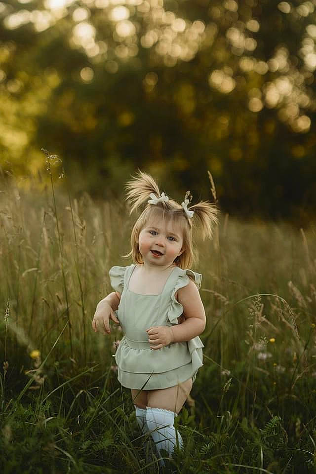 Skylar joined the competition — help win amazing prizes! eye, face, flash_photography, gesture, grass, grass_family, grassland, hair, happy, leaf, meadow, morning, nature, people_in_nature, person, plant, smile, summer, sunlight, toddler