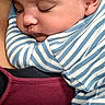 baby, sleeping, striped_clothing, onesie, infant, child, closeup, face, portrait, person, comfort, cuddle, snuggle, adult, maroon_top, skin, hair, peaceful, rest, indoor