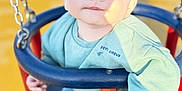 Keyden a rejoint le concours — aidez-le/la à gagner de superbes lots ! baby, child, clothing, cute, expression, eyes, face, footwear, hand, jeans, metal_chain, outdoor, person, playground, seat, shadow, sock, sunlight, sweater, swing