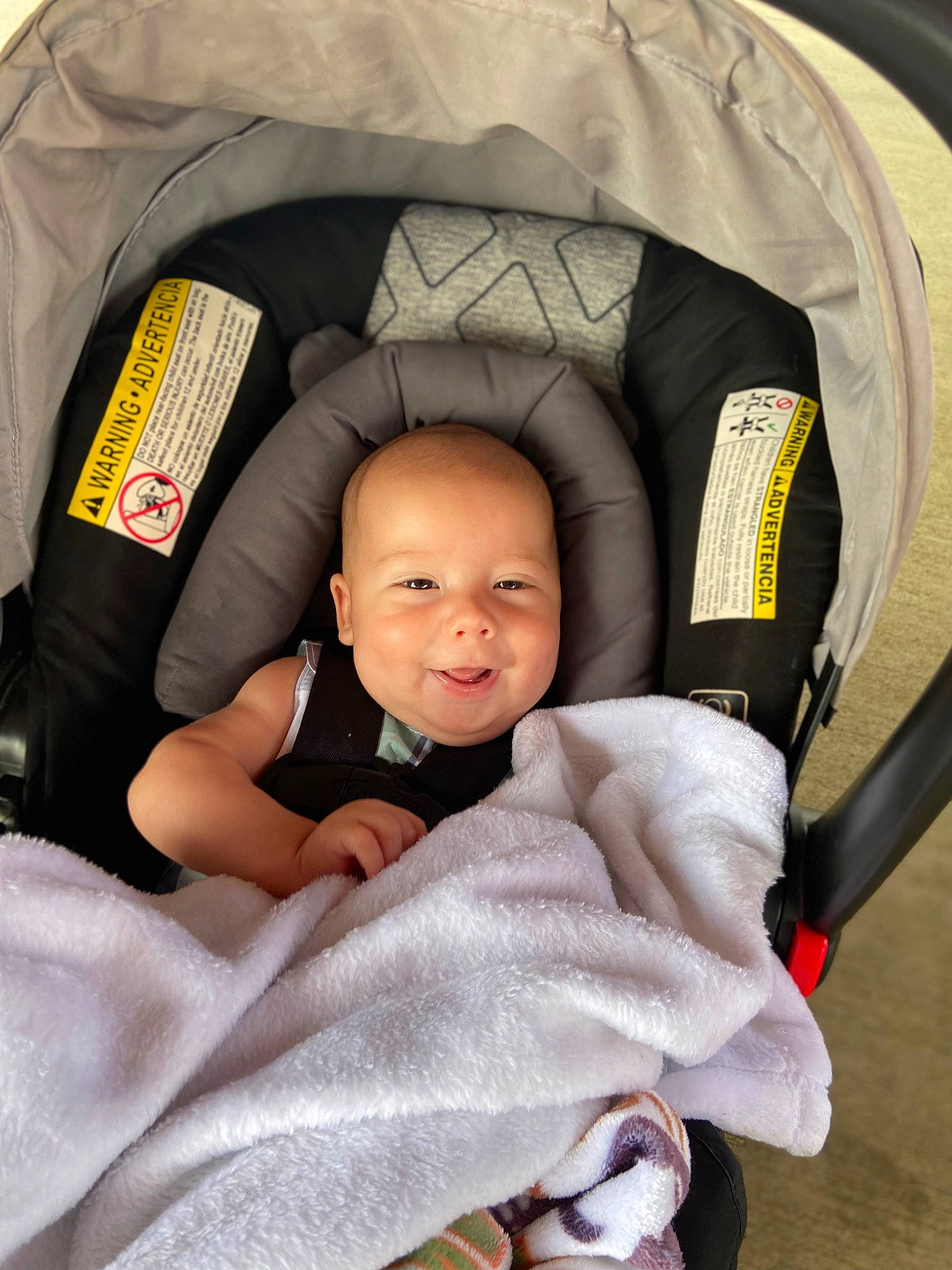 Layton is registered to the contest to win money with this photo: auto_part, baby, baby_carriage, baby_in_car_seat, baby_products, baby_safety, baby_toddler_clothing, beauty, car_seat, child, comfort, finger, fun, infant_bed, linens, people, person, sitting, sleeve, smile
