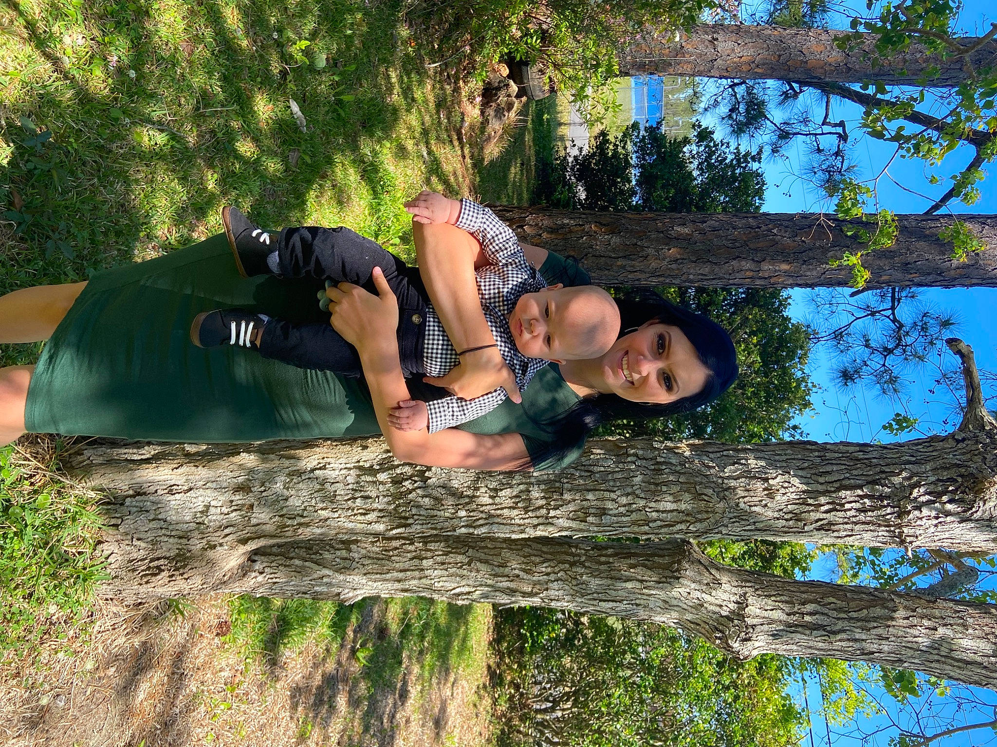 Layton joined the competition — help win amazing prizes! branch, eyewear, forest, fun, grass, happy, joy, leisure, nature, people_in_nature, person, plant, sky, spring, sunlight, thigh, tree, trunk, water, wood