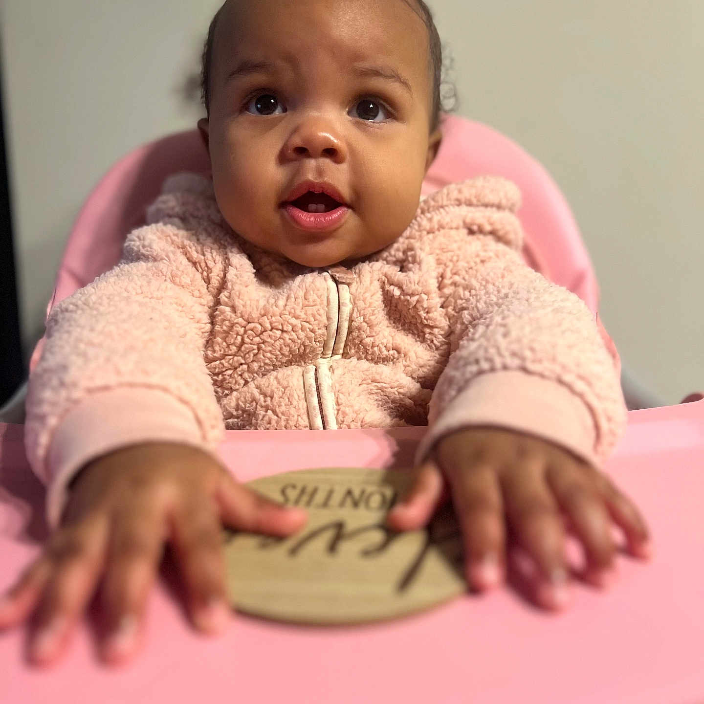 Aryya is registered to the contest to win money with this photo: baby, babylaughing, bodypart, clothing, face, finger, hand, happy, head, knitwear, person, photography, portrait, sitting, smile, sweater