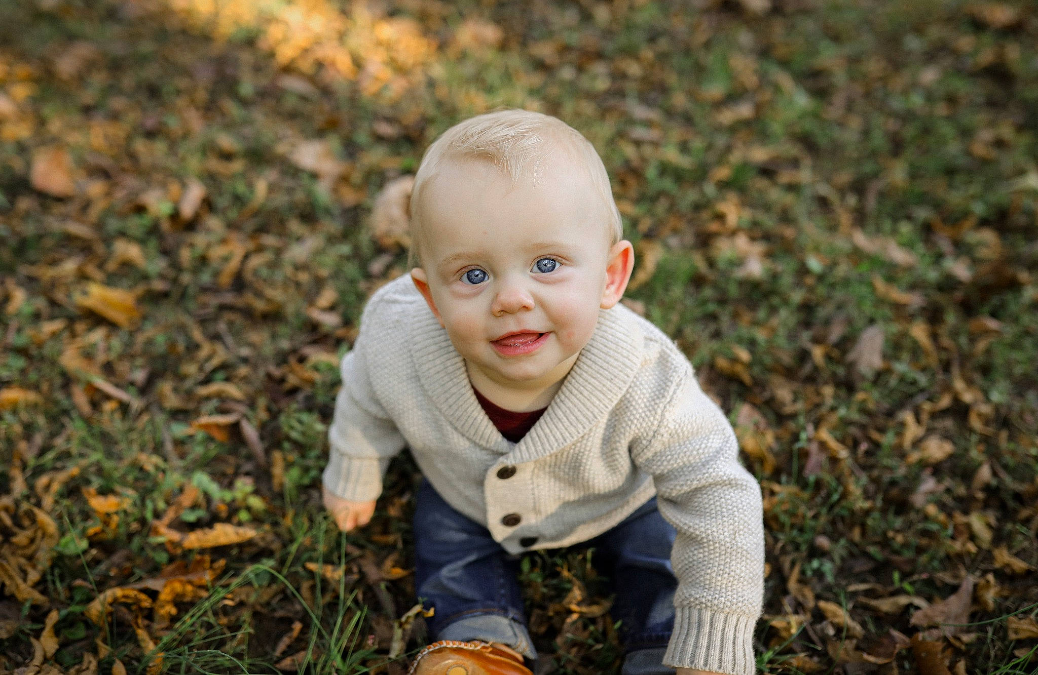 Slade is registered to the contest to win money with this photo: baby, baby_toddler_clothing, child, face, flash_photography, flooring, grass, grey, happy, joy, lawn, outerwear, people_in_nature, person, plant, prairie, sitting, smile, soil, toddler