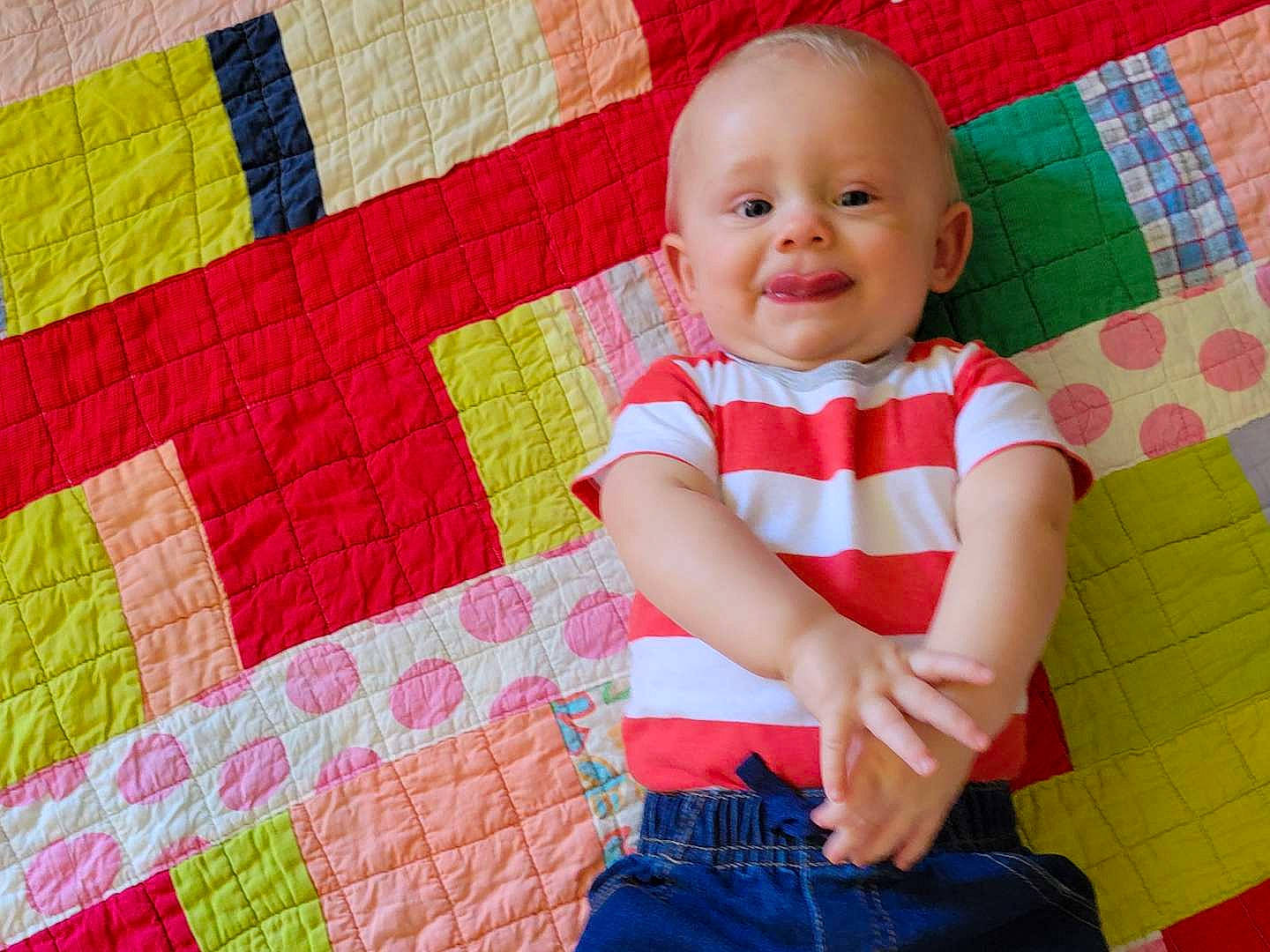 Slade is registered to the contest to win money with this photo: azure, baby_toddler_clothing, blue, eye, face, facial_expression, fun, happy, head, joy, organ, person, photograph, pink, product, purple, red, skin, sleeve, smile