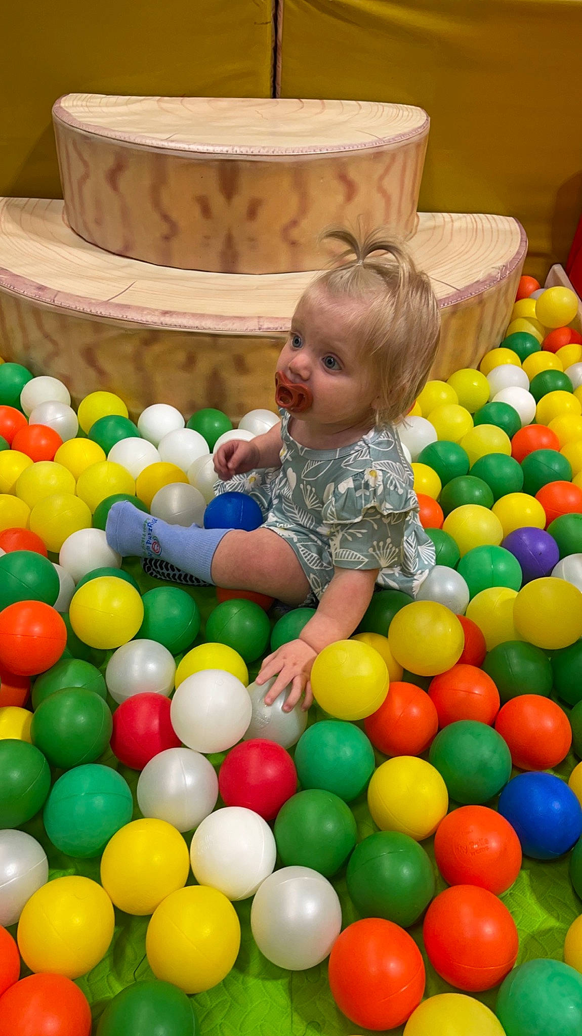 Jaycee is registered to the contest to win money with this photo: ball, ball_pit, child, event, fun, green, happy, human_settlement, leisure, person, photograph, play, playground, recreation, smile, snapshot, sports_toy, sweetness, t_shirt, toddler