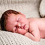 Ivy joined the competition — help win amazing prizes! baby, sleeping, blanket, cozy, infant, soft_lighting, face, skin, newborn, peaceful, closeup, portrait, knitted, resting, cute, child, nap, indoors, relaxing, warm