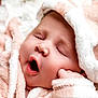 baby, sleeping, yawning, blanket, soft, fluffy, close_up, face, peaceful, infant, cute, skin, wrapped, cozy, child, newborn, resting, pink, white, portrait