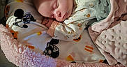 Addison is registered to the contest to win money with this photo: baby, bedding, blanket, child, cozy, cute, foot, green, indoors, infant, mickey_mouse, pajamas, pattern, peaceful, pink, portrait, resting, sleeping, soft_texture, toes