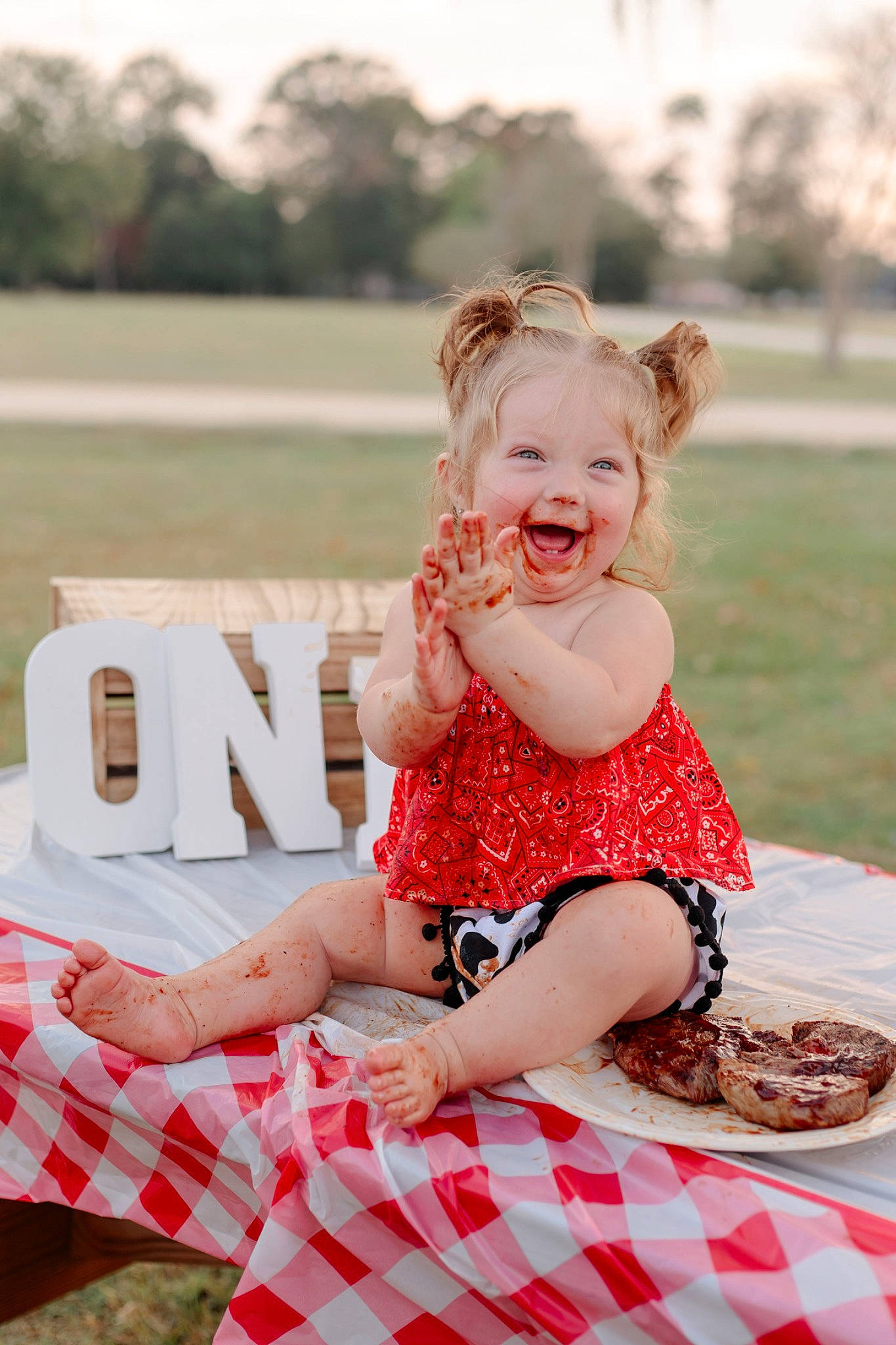Wiley is registered to the contest to win money with this photo: arm, baby_toddler_clothing, beauty, child, dress, flash_photography, grass, happy, head, human_leg, leg, pattern, person, photograph, pink, skin, smile, summer, thigh, toddler