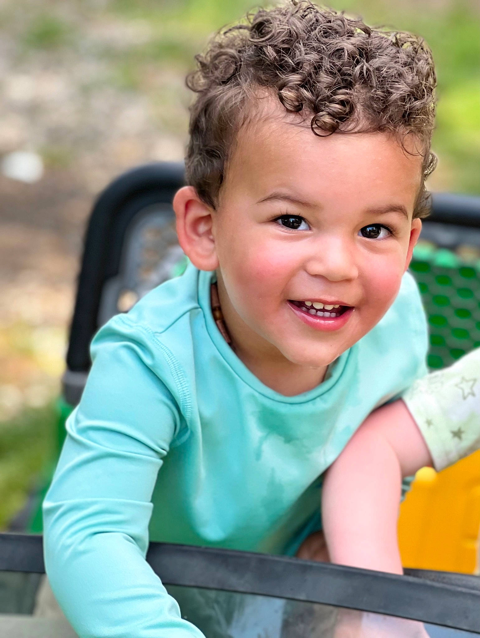 Korbyn joined the competition — help win amazing prizes! arm, baby_products, blond, child, eye, fun, grass, happy, human_body, joy, laugh, leisure, outdoor_play_equipment, people_in_nature, person, recreation, sitting, skin, smile, t_shirt