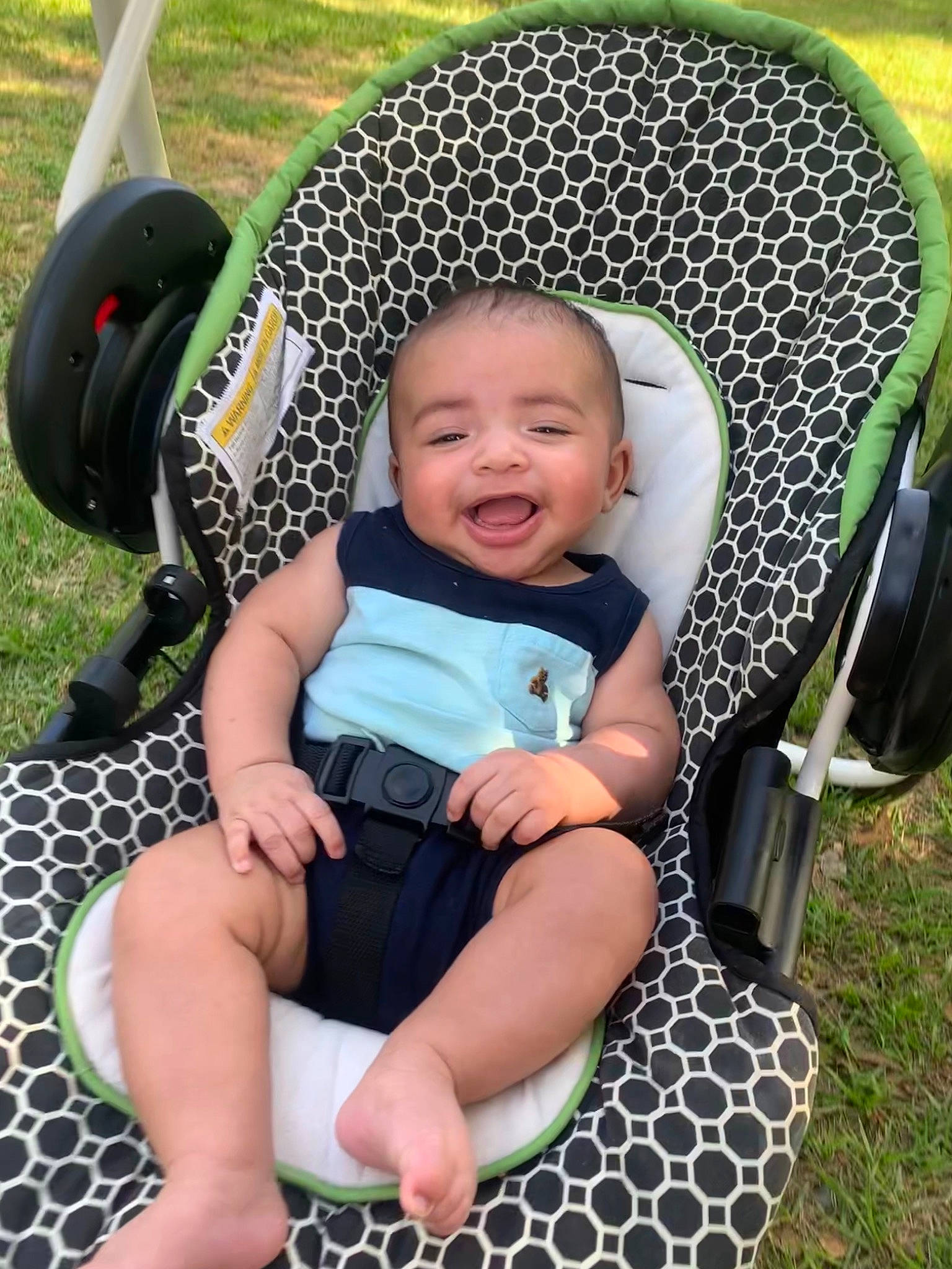 Khyzen joined the competition — help win amazing prizes! baby, baby_carriage, baby_toddler_clothing, black, chair, child, comfort, fun, grass, green, happy, leaf, leisure, person, photograph, product, shoe, smile, sneakers, toddler