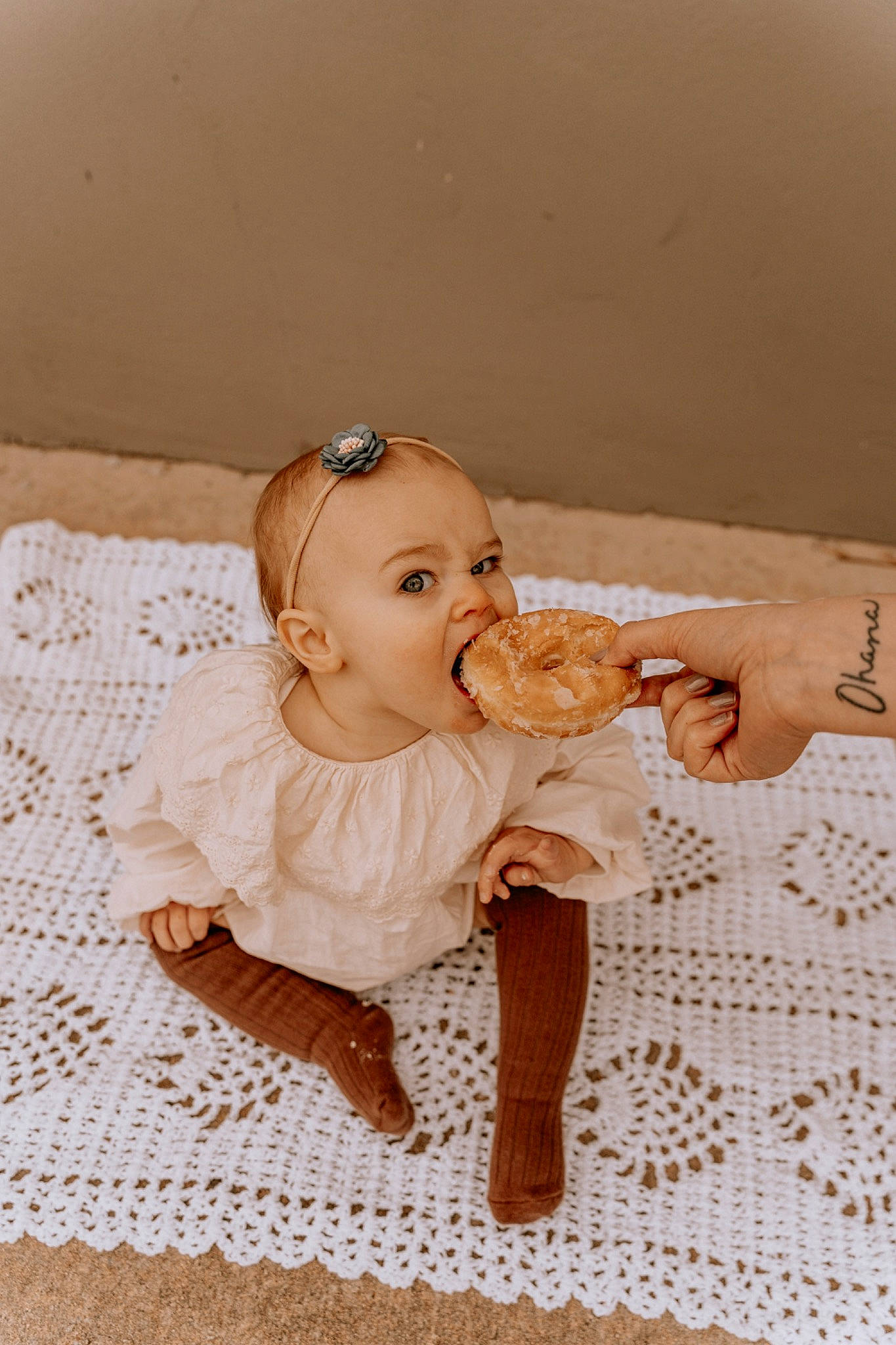 Claire is registered to the contest to win money with this photo: baby, baby_toddler_clothing, bridal_accessory, child, dress, fashion_design, flash_photography, floor, flooring, happy, headpiece, linens, pattern, peach, person, room, sitting, skin, toddler, vintage_clothing