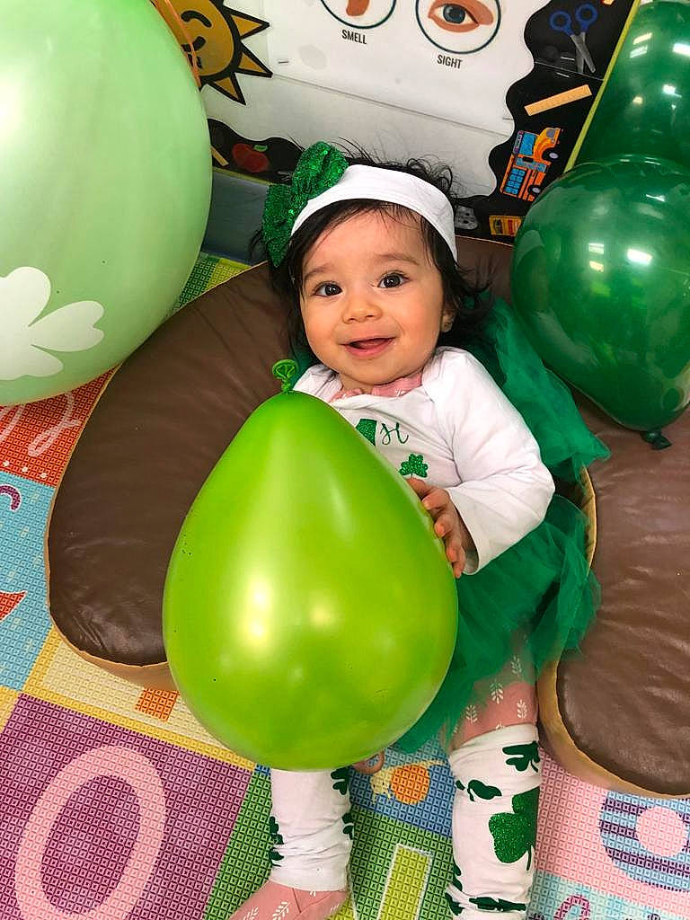 Riley joined the competition — help win amazing prizes! baby, baby_toddler_clothing, balloon, child, event, fun, green, happy, headwear, holiday, joy, leisure, party, party_supply, person, photograph, play, recreation, smile, snapshot