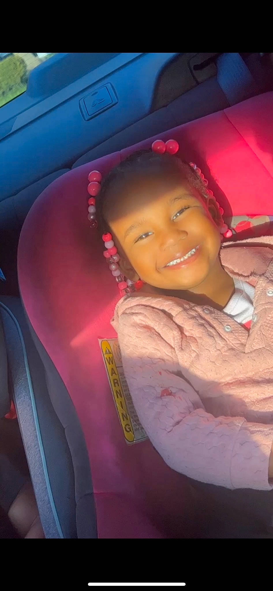 Lamiyah is registered to the contest to win money with this photo: auto_part, automotive_design, automotive_exterior, automotive_lighting, black_hair, car, car_seat, car_seat_cover, flash_photography, fun, happy, joy, magenta, motor_vehicle, person, pink, skin, smile, steering_wheel, tints_and_shades