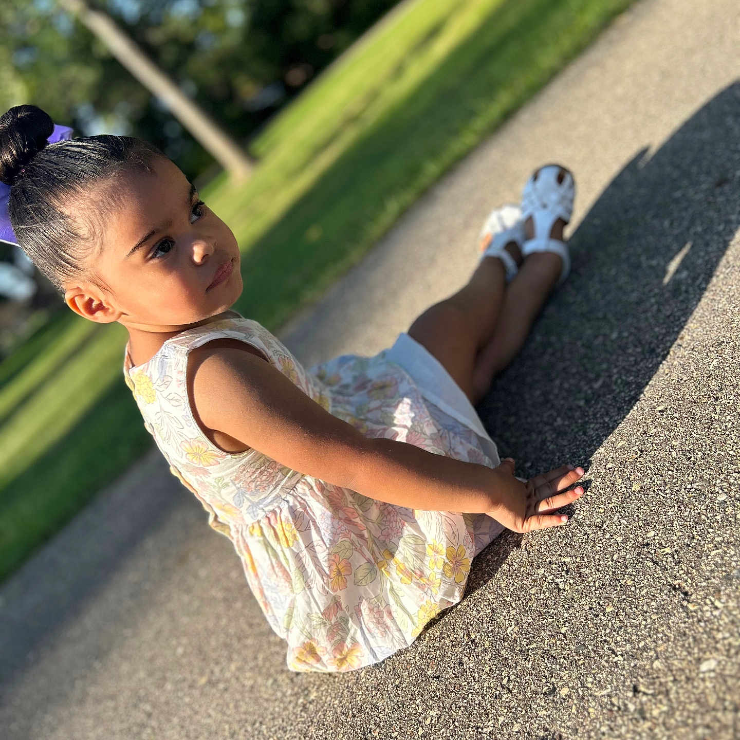 Aaliyah is registered to the contest to win money with this photo: bodypart, child, clothing, dress, face, female, finger, girl, grass, head, nature, outdoors, park, person, photography, plant, portrait, road, sitting, walking