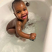 Kymani joined the competition — help win amazing prizes! baby, bathtub, bath, water, bubbles, smile, child, happy, splash, skin, wet, infant, cute, tooth, person, young, playful, indoors, clean, shiny