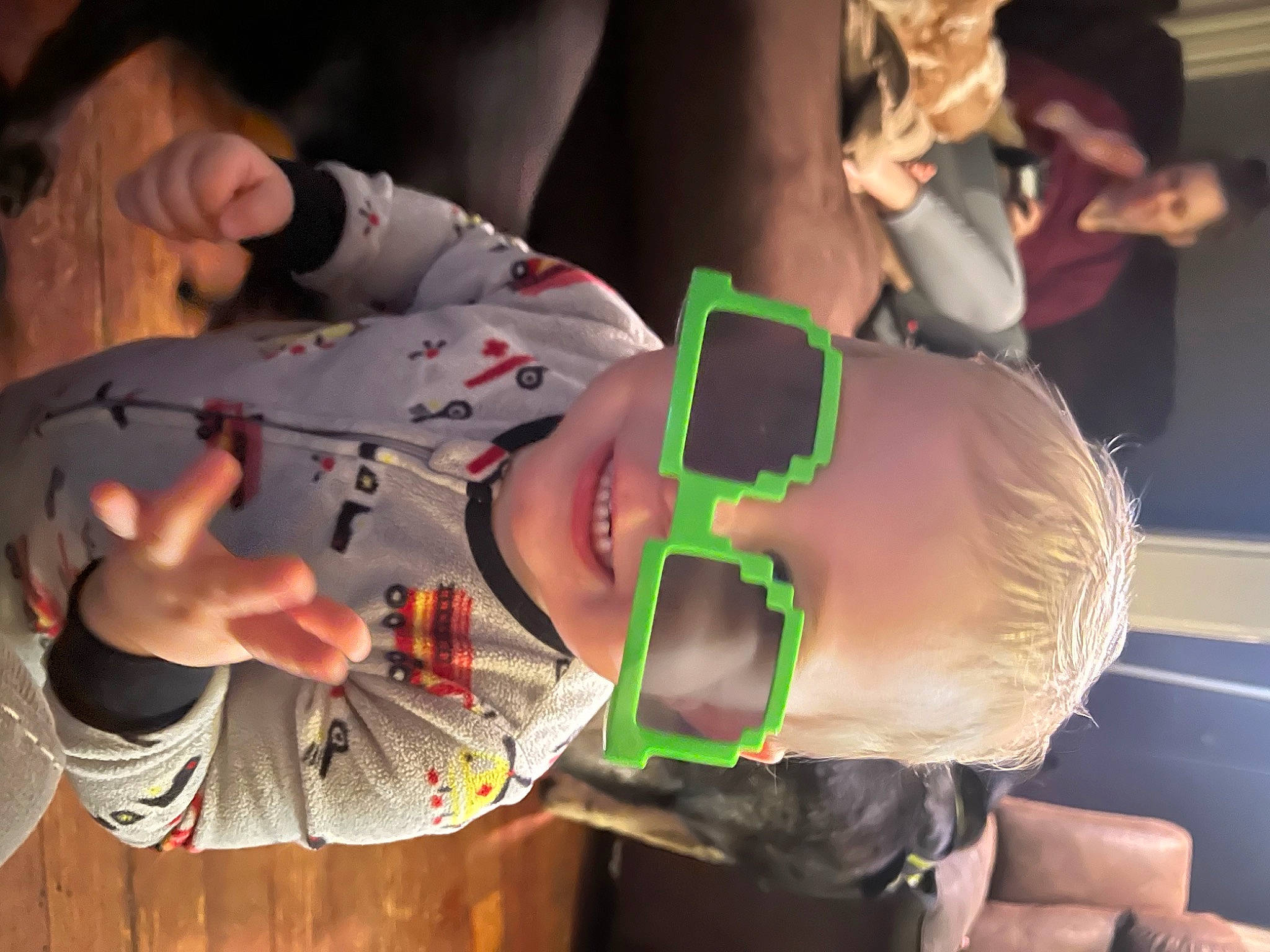 Jonah is registered to the contest to win money with this photo: child, elbow, event, eyewear, flesh, fun, nail, pattern, person, personal_protective_equipment, wrist