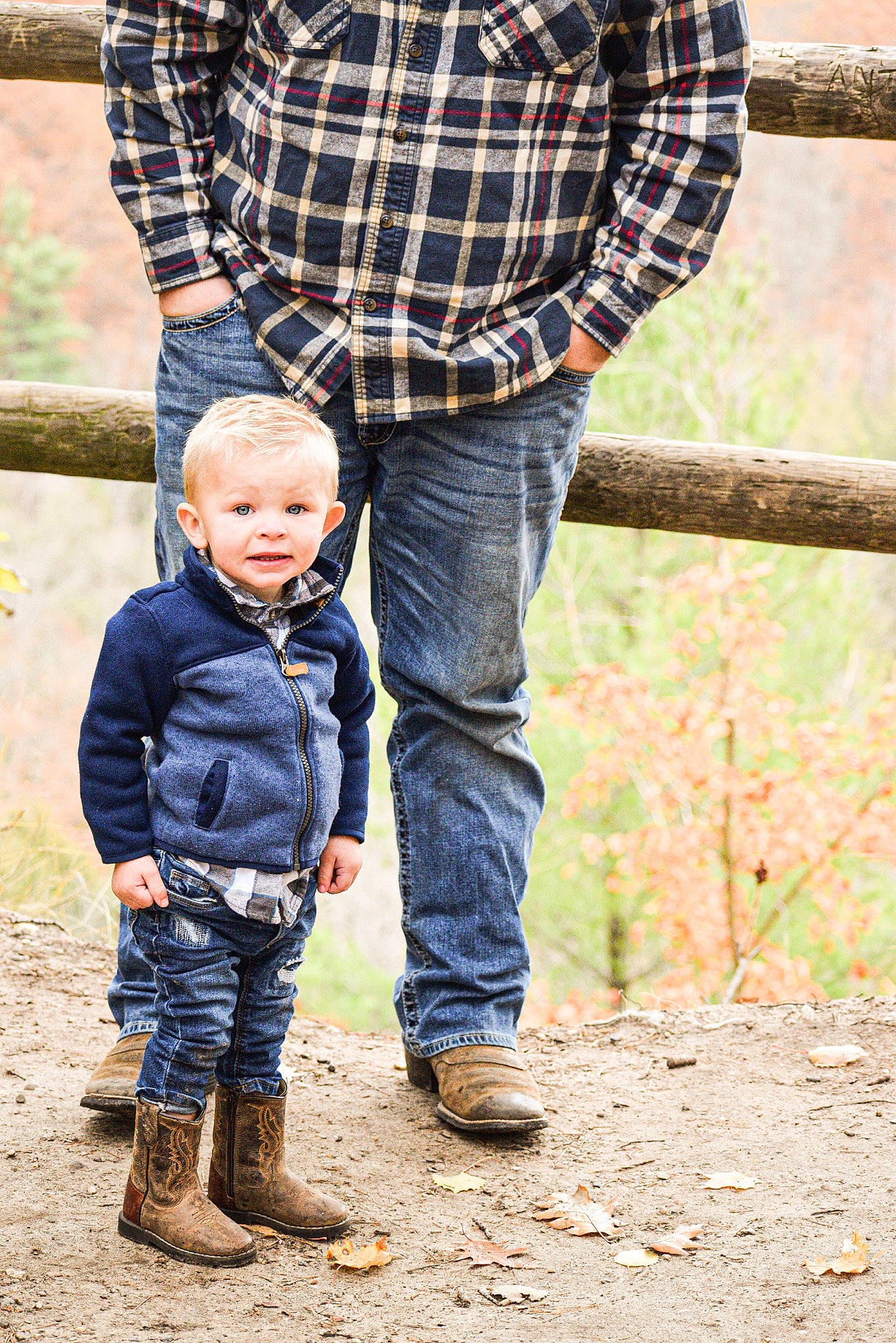 Brantley is registered to the contest to win money with this photo: baby, denim, footwear, fun, gesture, grass, happy, interaction, jeans, leg, leisure, outerwear, people_in_nature, person, plaid, plant, shoe, tartan, toddler, tree