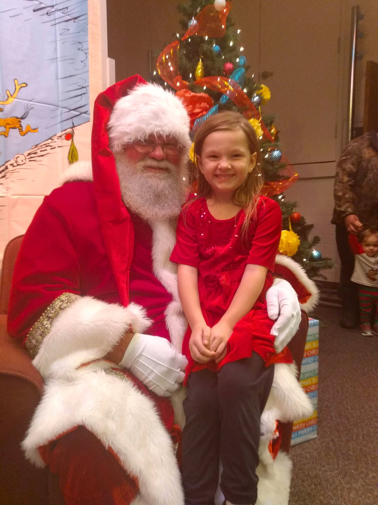 Abigail joined the competition — help win amazing prizes! beard, christmas, christmas_decoration, christmas_eve, christmas_ornament, christmas_tree, event, fictional_character, fun, fur, happy, hat, holiday, joy, lap, person, santa_claus, smile, standing, toddler