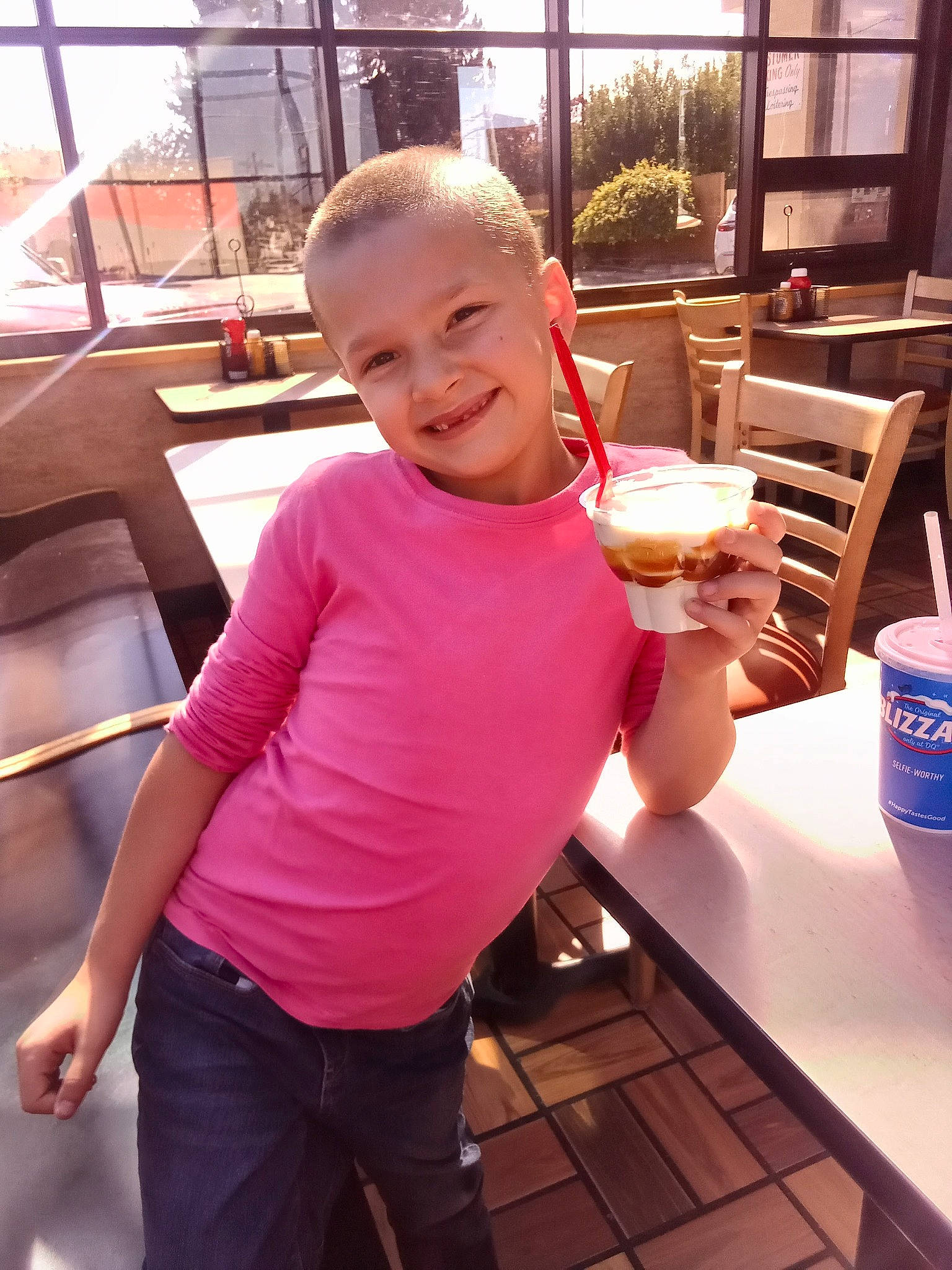 Abigail is registered to the contest to win money with this photo: cup, drink, drinking, drinking_straw, finger, food, fun, happy, joy, leisure, muscle, person, photograph, shorts, smile, snapshot, summer, t_shirt, table, tableware