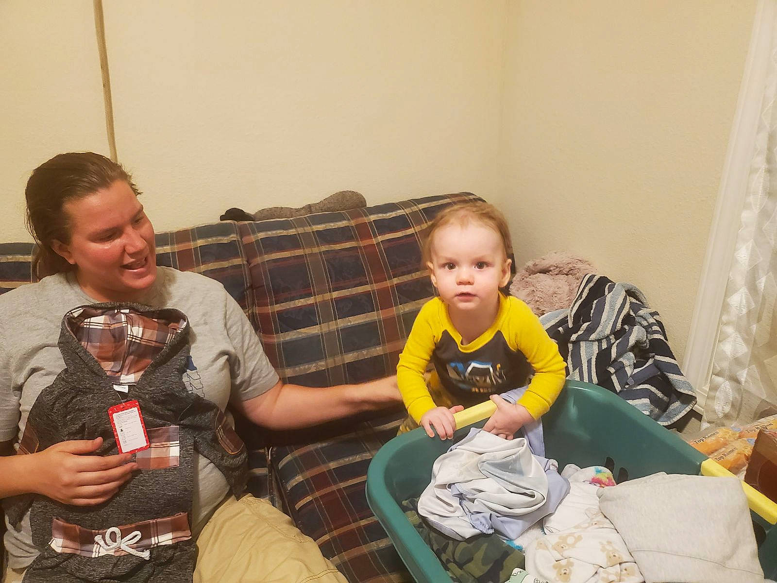 Gage joined the competition — help win amazing prizes! baby, chair, child, comfort, couch, curtain, event, fun, happy, head, joy, lap, living_room, person, room, sharing, shorts, sitting, smile, t_shirt