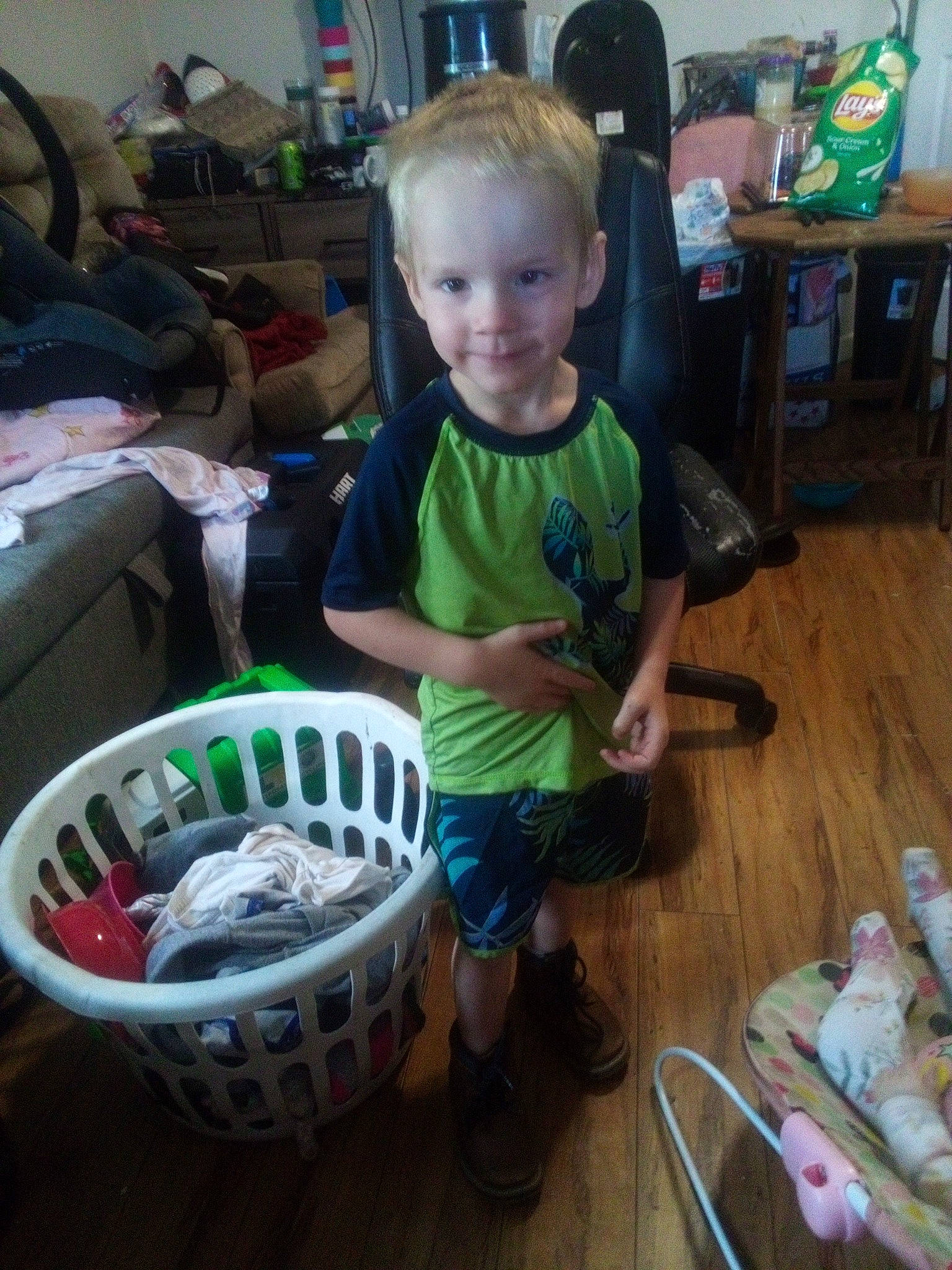 Gage joined the competition — help win amazing prizes! auto_part, automotive_tire, automotive_wheel_system, chair, child, flooring, green, hardwood, joy, person, play, rim, room, sandal, shorts, sitting, smile, sneakers, spoke, t_shirt