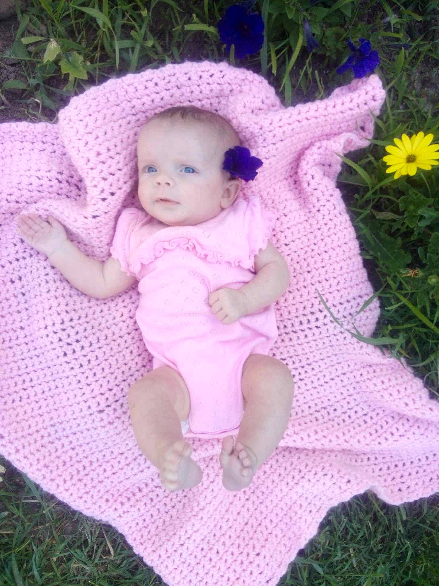 Novarose joined the competition — help win amazing prizes! baby, baby_products, baby_toddler_clothing, embellishment, fashion_accessory, fawn, flower, grass, happy, headband, magenta, pattern, person, pink, plant, purple, sitting, textile, toddler, violet
