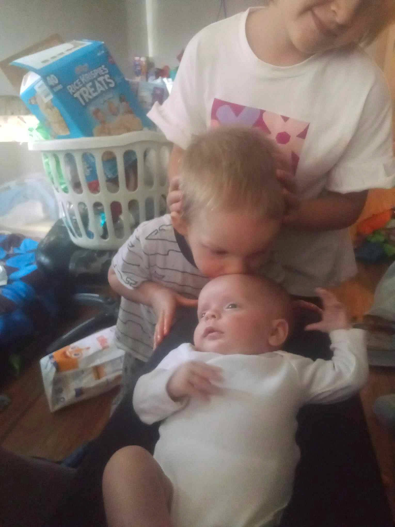 Novarose is registered to the contest to win money with this photo: baby, baby_toddler_clothing, chair, cheek, child, ear, eye, fun, happy, iris, lap, people, person, play, room, sharing, sitting, skin, t_shirt, tin_can