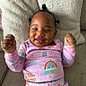 baby, child, smiling, pajamas, rainbow, couch, pillow, happy, infant, clothing, indoors, cute, portrait, person, furniture, cozy, relaxing, young, bedroom, home