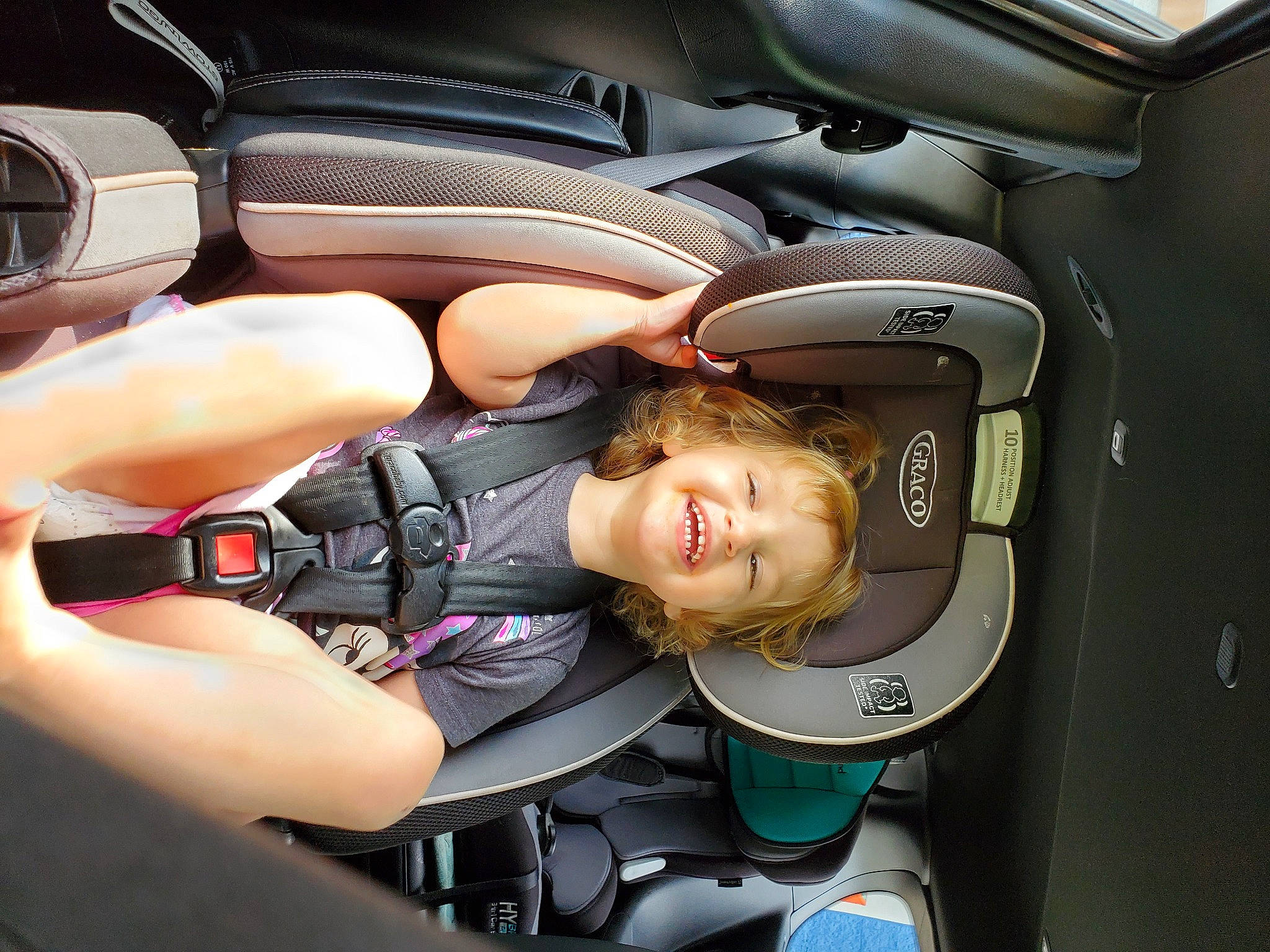 Cecilia is registered to the contest to win money with this photo: auto_part, automotive_design, automotive_exterior, automotive_wheel_system, baby_carriage, car, car_seat, car_seat_cover, comfort, family_car, head_restraint, joy, motor_vehicle, person, personal_luxury_car, plant, seat_belt, smile, steering_part, steering_wheel