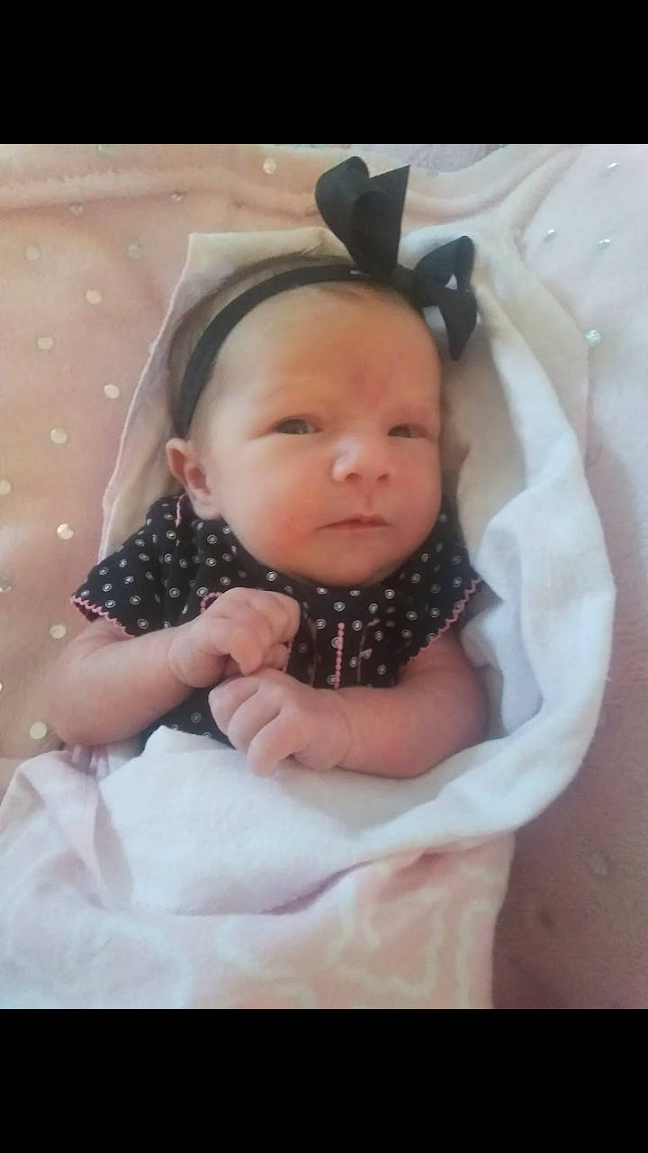 Hailie is registered to the contest to win money with this photo: baby, baby_products, black_hair, cheek, child, ear, eye, face, forehead, hair_accessory, head, headgear, iris, nose, person, product, skin, smile, toddler