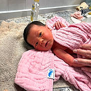 Shiloh joined the competition — help win amazing prizes! newborn, baby, pink_towel, bath_time, hand, countertop, beige_towel, bottle, sink, tile_wall, infant, wrapped, soft_texture, skin, small_hand, cute, indoors, cleaning, fresh, resting