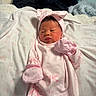 Shiloh is registered to the contest to win money with this photo: baby, newborn, pink_clothing, mittens, headband, bow, blanket, soft_texture, sleepwear, infant, cute, portrait, lying_down, indoors, baby_girl, cozy, sleepy, small_hands, adorable, face