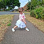 Violet joined the competition — help win amazing prizes! child, girl, sidewalk, pose, pigtails, pink_clothing, white_skirt, shoes, outdoor, daytime, trees, bushes, residential, pavement, grass, playful, expression, hair_clips, casual, cute